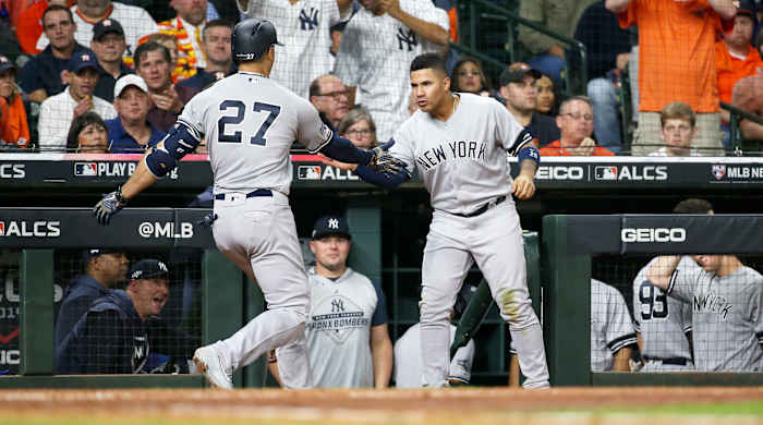 Oct 12, 2019; Houston, TX, USA; New York Yankees left fielder Giancarlo Stanton (27) celebrates with second baseman Gleyber Torres (25) after hitting a solo home run against the Houston Astros in the sixth inning in game one of the 2019 ALCS playoff baseball series at Minute Maid Park. Mandatory Credit: Troy Taormina-USA TODAY Sports